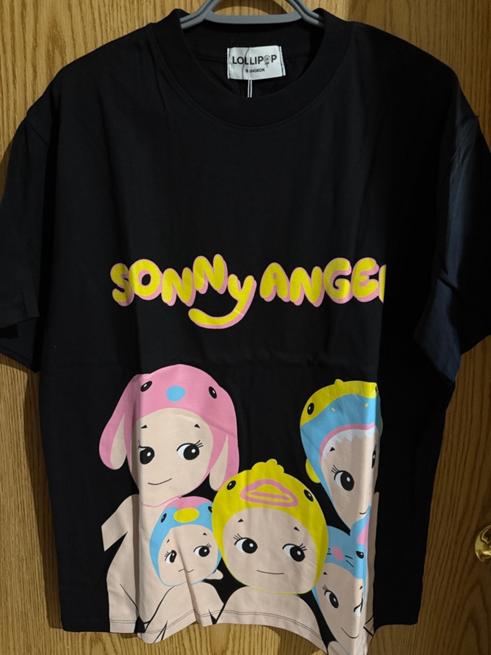 Lolli Sonny Angel Graphic Tee in Black with Pink Yellow Blue Accents